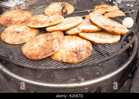 Pita, Arabic bread, soft baked flatbreads on grill Stock Photo