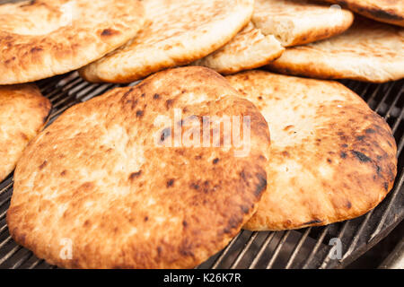Pita, Arabic bread, soft baked flatbreads on grill Stock Photo