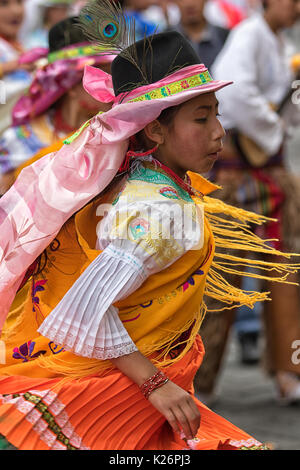 June 17, 2017 Pujili, Ecuador: female dancer dressed in traditional clothing in motion at the Corpus Christi annual parade Stock Photo