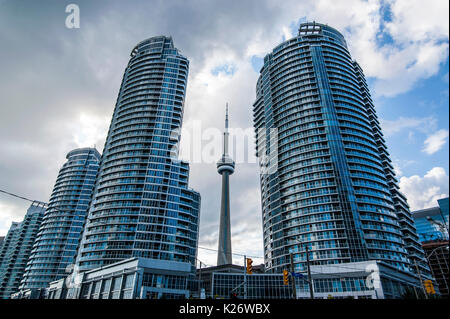 CN Tower behind high rise buildings, downtown, Toronto, Ontario, Canada Stock Photo