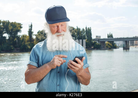 Old man talking on the phone Stock Photo