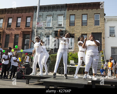 Girls entertaining at block party in the Bedford Stuyvesant section of Brooklyn, NY, Aug.26, 2017.