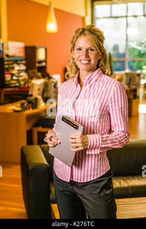 Portrait of a woman in an creative office work setting. Stock Photo