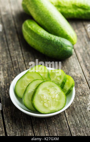 Sliced green cucumbers. Cucumbers in bowl. Stock Photo