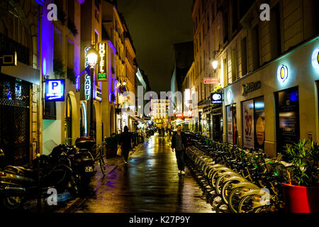 General views of colorful reflections and people on a rainy night in Paris, France on September 17, 2016. Stock Photo