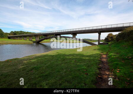 The Welsh water road bridge to allow access to the Ogmore sewerage plant on the opposite bank of the river Ogmore. Stock Photo