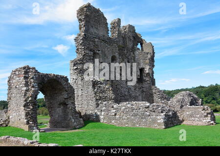 the tallest remianing wallof Ogmore castle saton the banks of the Ewenny river well known for its stepping stones this ruin is well worth a visit. Stock Photo