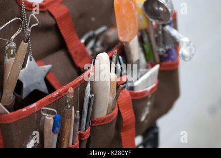 Artist tote organizer filled with pottery tools Stock Photo