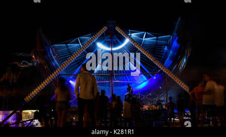 Fun fair swing ride spinning Stock Photo - Alamy