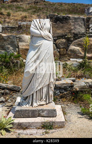 Headless statue standing amidst the ruins of Delos, Cyclades, Greece. Stock Photo