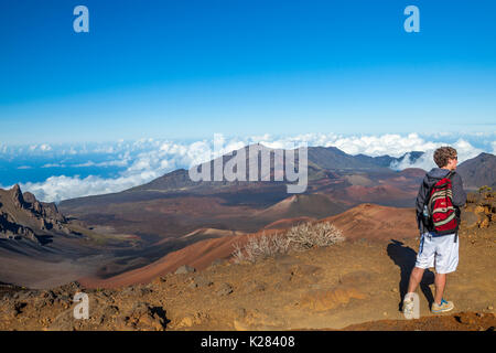 Teenager hikes on the Sliding Sands Trail  in Haleakala National Park on Maui Stock Photo