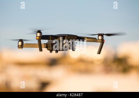Mavic Pro quadcopter drone in flight. Stock Photo