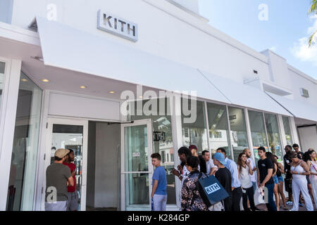 Miami Beach Florida,Collins Avenue,Kith,store,outside exterior,lifestyle brand,footwear,entrance,line,queue,clothing,young adults,waiting,FL170430248 Stock Photo