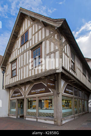 Historic Tudor building with exposed timber frame on Butcher Row under blue sky in Salisbury, Wiltshire, England Stock Photo
