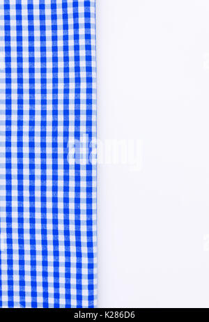 Blue cloth, a kitchen towel with a checkered pattern, on a white background isolated. Stock Photo