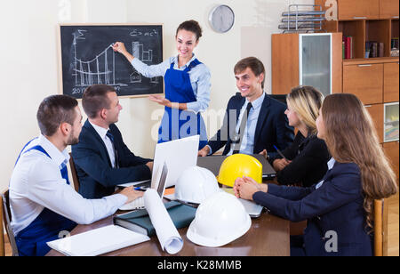 Team of architects, designers and constructors at the working meeting in office. Selective focus Stock Photo