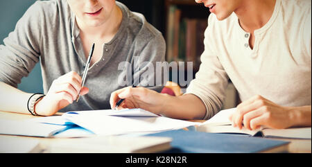 Handsome student working on an essay Stock Photo