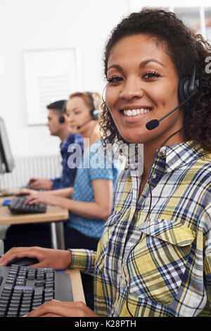 Female Customer Services Agent In Call Centre Stock Photo