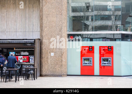 National Australia Bank NAB cash ATM machines next to a coffee shop in Sydney city centre,New south wales,Australia Stock Photo