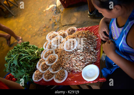 Shrimp stall in Belem Market, Iquitos, Peru. The animal is caught locally and sold in plate portions ready to be eaten. Stock Photo