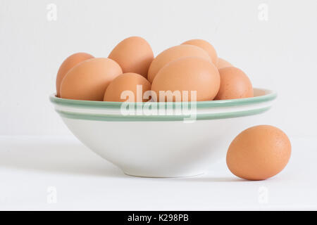 eggs in white bowl on white background Stock Photo