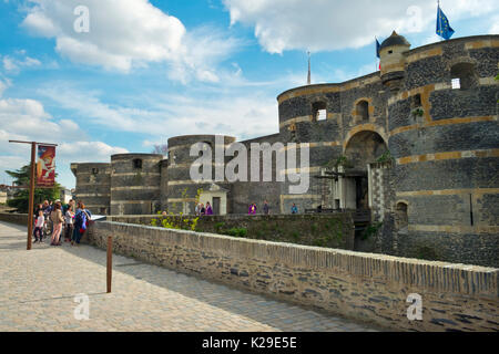 Visitors to the Chateau d'Angers gather at the entrance on a sunny spring afternoon in Angers, Maine-et-Loire, France Stock Photo