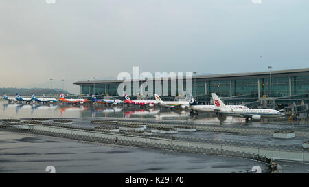 Chongqing, China. 29th Aug, 2017. Passenger flights park at the T3A terminal of the Jiangbei Airport in Chongqing, southwest China, Aug. 29, 2017. The T3A terminal and the third runway of the airport are put into operation on Tuesday. Credit: Liu Chan/Xinhua/Alamy Live News Stock Photo