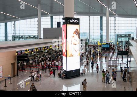 Chongqing, China. 29th Aug, 2017. Passengers check in at the T3A terminal of the Jiangbei Airport in Chongqing, southwest China, Aug. 29, 2017. The T3A terminal and the third runway of the airport are put into operation on Tuesday. Credit: Liu Chan/Xinhua/Alamy Live News Stock Photo