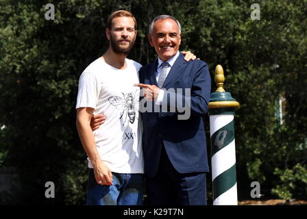Venice, Italy. 29th August, 2017. The italian actor Alessandro Borghi (L) will host the opening and closing ceremony poses with Director of the Venice Film Festival Alberto Barbera (R) during the 74th Venice International Film Festival in Venice Lido, Italy, 29 August 2017.(will run from August 30th to September 9th) Credit: Andrea Spinelli/Alamy Live News Stock Photo