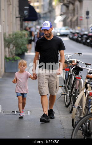 Milan, Borja Valero with her daughter in the center for the first time to know Milan The new purchase of INTER, the Spanish BORJA VALERO, bought by FIORENTINA, arrives for the first time in the center. Taking advantage of the championship stop, Borja Valero brings with her little daughter LUCIA around the city, and after walking all over the quadrilateral, she makes shopping in the 'Rinascente' in Corso Vittorio Emanuele. Stock Photo