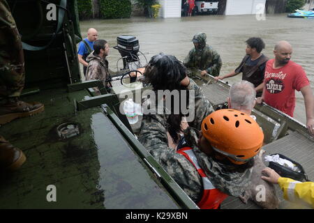 Texas, USA. 28th Aug, 2017. Texas National Guard soldiers and volunteer fire and rescue personnel evacuate residents and their pets trapped by flooding in the aftermath of Hurricane Harvey August 28, 2017 in Cypress, Texas. Credit: Planetpix/Alamy Live News Stock Photo