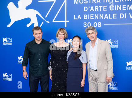 Venice, Italy. 30th Aug, 2017. Kristen Wiig (2nd L) and Hong Chau during a photocall for the movie 'Downsizing' at the 74th Venice Film Festival in Director Alexander Payne (R) poses with actors Matt Damon (1st L), Kristen Wiig (2nd L) and Hong Chau during a photocall for the movie 'Downsizing' at the 74th Venice Film Festival in Italy August 30, 2017. Credit: Jin Yu/Xinhua/Alamy Live News Stock Photo