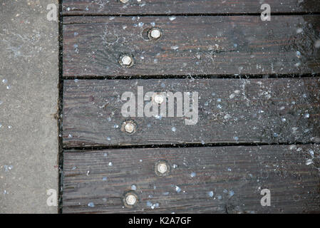 West Palm Beach, Florida, USA. 28th Aug, 2017. Water droplets and fish scales splash down on the Lake Worth's Municipal Pier's surface near a fish cleaning station on Sunday, August 27, 2017, in Lake Worth, Fla. Credit: Andres Leiva/The Palm Beach Post/ZUMA Wire/Alamy Live News Stock Photo