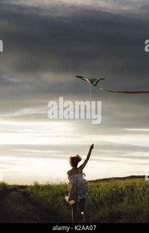 Anonymous girl with kite Stock Photo