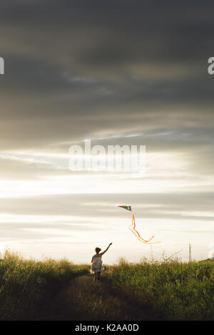 Anonymous girl with kite Stock Photo