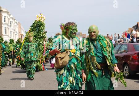 Costumed people and the Jack parade along the West Hill at the annual Jack In The Green festival at Hastings, England on May 5, 2014. Stock Photo