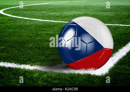 High quality render of soccer ball ready to shoot at at soccer field on green grasses. 3D rendering. Stock Photo