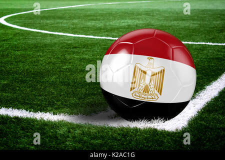 High quality render of soccer ball ready to shoot at at soccer field on green grasses. 3D rendering. Stock Photo