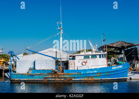 A sponge diving boat tied up on the Anclote River in Tarpon Springs Florida, USA, where the small Greek community continues to thrive on tourism. Stock Photo