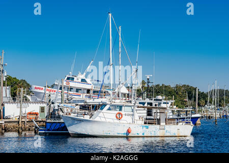 Sponge diving boats tied up on the Anclote River in Tarpon Springs Florida, USA, where the small Greek community continues to thrive on tourism. Stock Photo