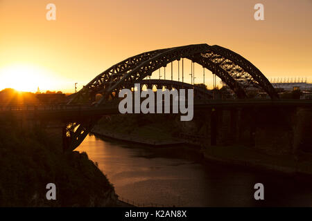 Sunset over the River Wear in Sunderland, England. Wearmouth Bridge spans the river. Stock Photo