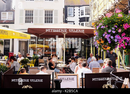 Brighton summer views in August 2017 - Patisserie Valerie coffee shop and cafe with people eating and drinking outside in The Lanes district Stock Photo