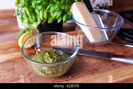 Making home made Italian  pesto sauce with basil parmesan cheese garlic and pine nuts with olive oil Stock Photo