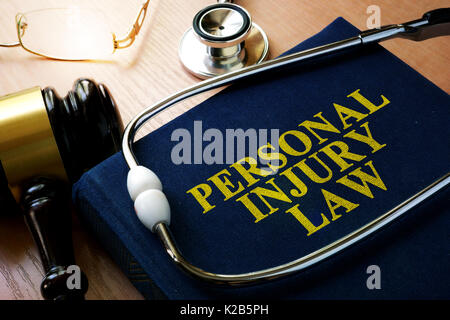 Personal Injury Law concept. Book and stethoscope. Stock Photo