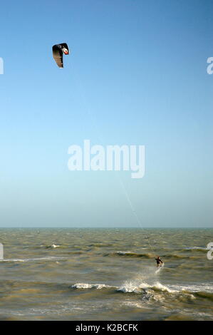 AJAXNETPHOTO. WORTHING, ENGLAND. - A KITE SURFER WAVE JUMPING OFF THE COAST IN HIGH WINDS. PHOTO:JONATHAN EASTLAND/AJAX REF:R61209 1132 Stock Photo