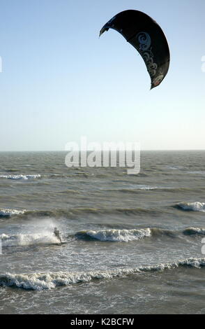 AJAXNETPHOTO. WORTHING, ENGLAND. - A KITE SURFER WAVE JUMPING OFF THE COAST IN HIGH WINDS. PHOTO:JONATHAN EASTLAND/AJAX REF:R61209 1135 Stock Photo
