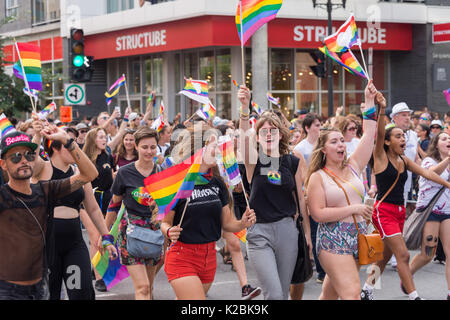 Montreal, CA - 20 August 2017:  happy and smiling People taking part in Montreal Gay Pride Parade. Stock Photo