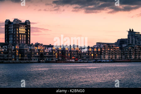 London, England - February 19, 2016 - River Thames at sunset at Battersea Riverside, with apartment buildings of Fulham. Stock Photo