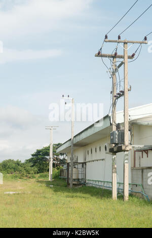 Electrician repair of electric poles. The electric poles supporting wires low voltage and high voltage. Stock Photo