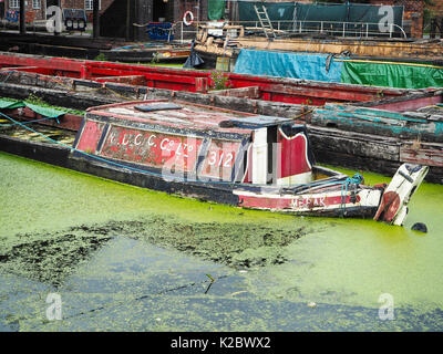 Half sunken canal barges and butty at boat museum, Ellesmere Stock Photo